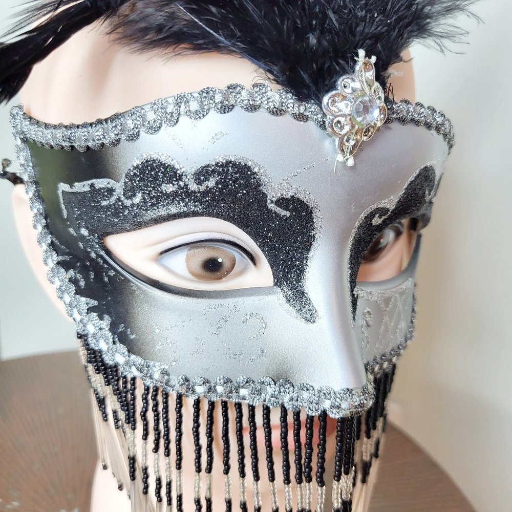 Black and silver masquerade mask with feathers, minor flaws